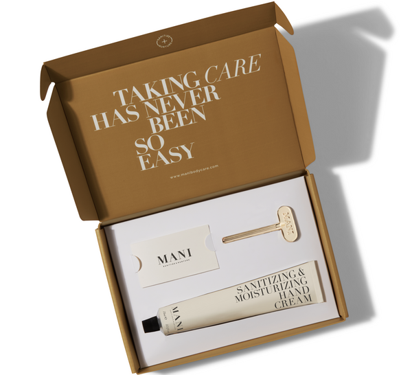 mani sanitizing moisturizing hand cream with mani gold-plated key in a box with writing "taking care has never been so easy"